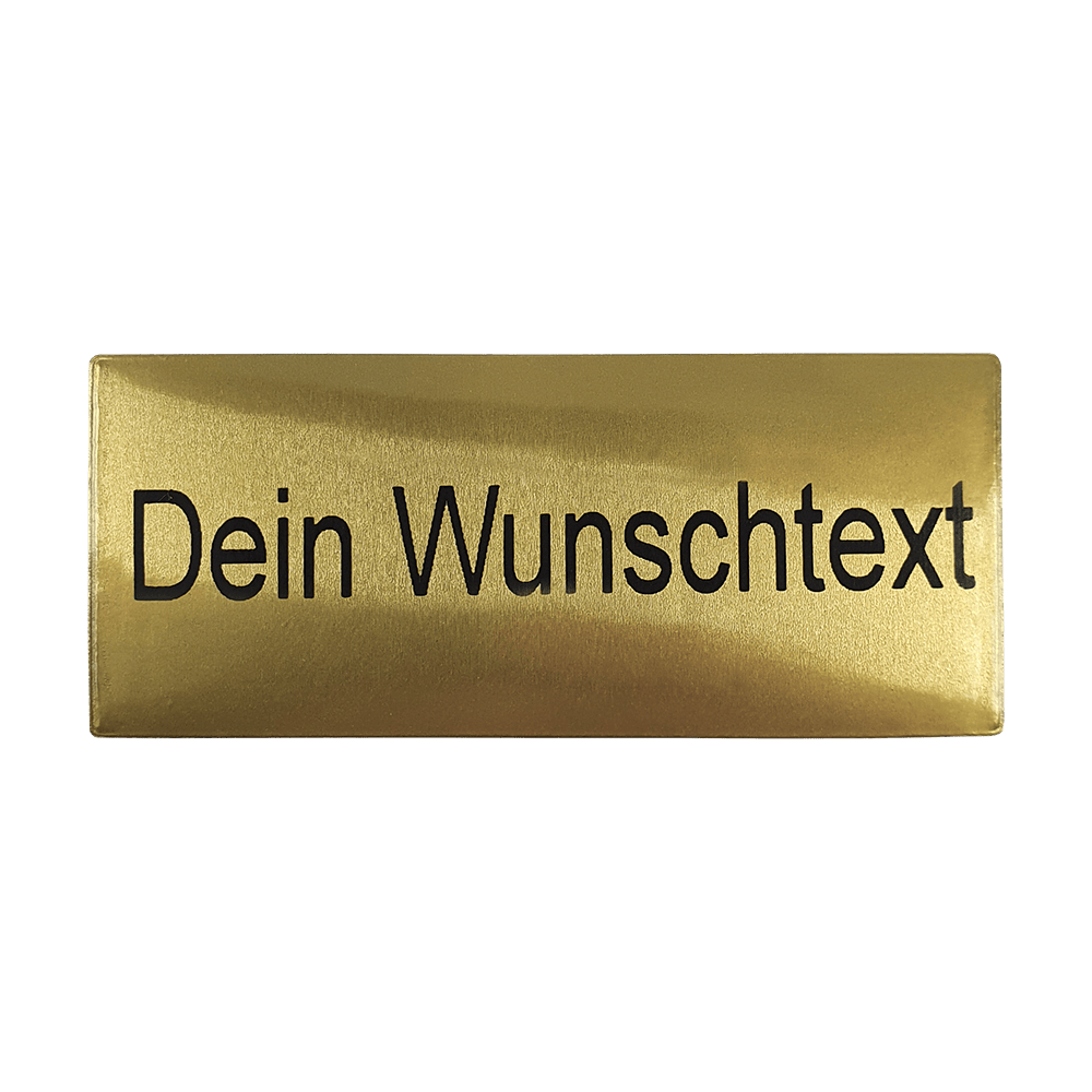 P-Schild_McDart_Pokalschild_mit_Wunschtext_1 Das Bild zeigt ein goldenes Pokalschild mit der Aufschrift „Dein Wunschtext“. Auf diesem Schild kann ein individueller Text eingraviert werden.