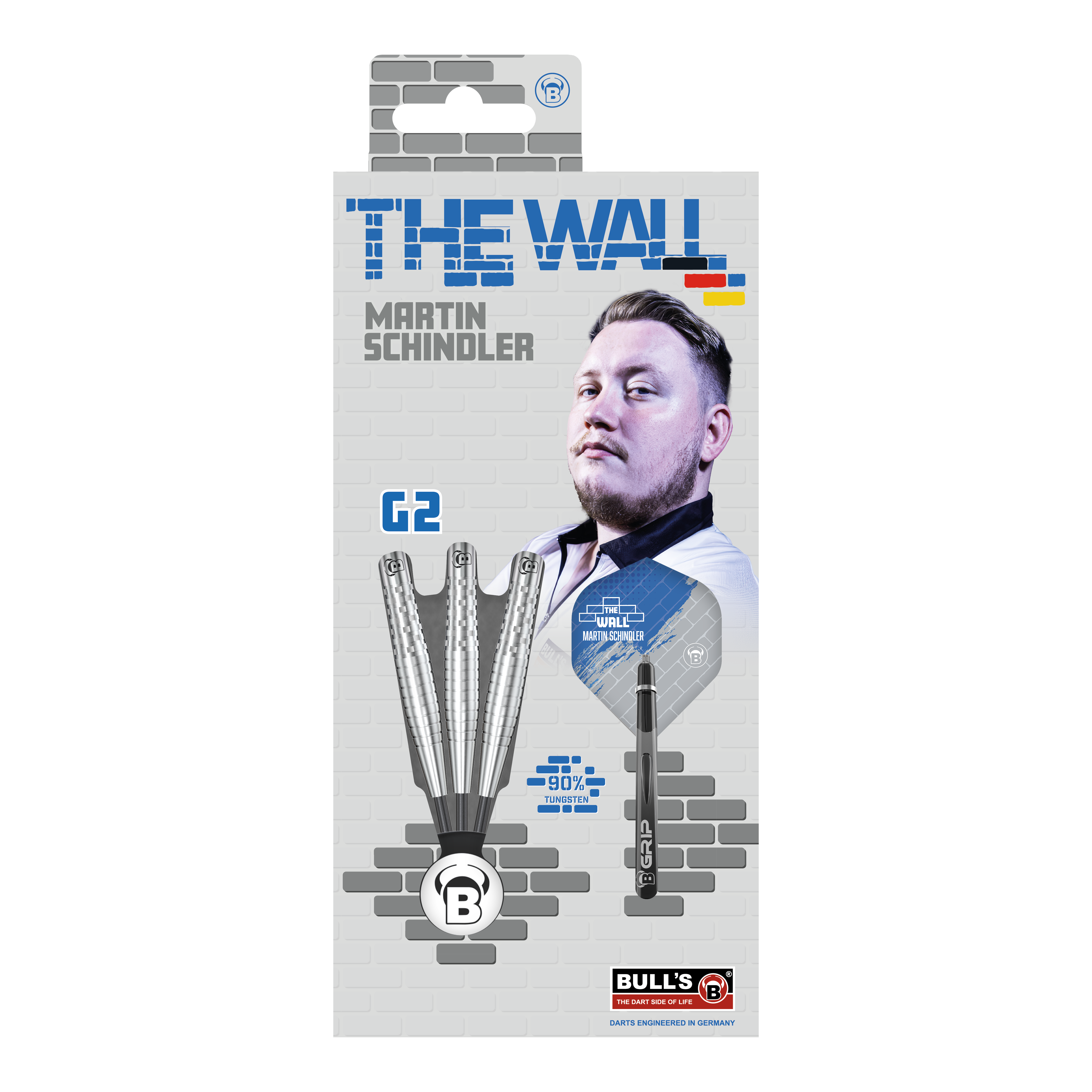 Bulls Martin Schindler Original Generation 2 freccette in acciaio Die Verpackung zeigt die "Bulls Martin Schindler Original Generation 2 Steeldarts" mit dem Bild von Martin Schindler. Auf der Vorderseite sind drei Darts und die Aufschrift "THE WALL" sowie "90% Tungsten" abgebildet.