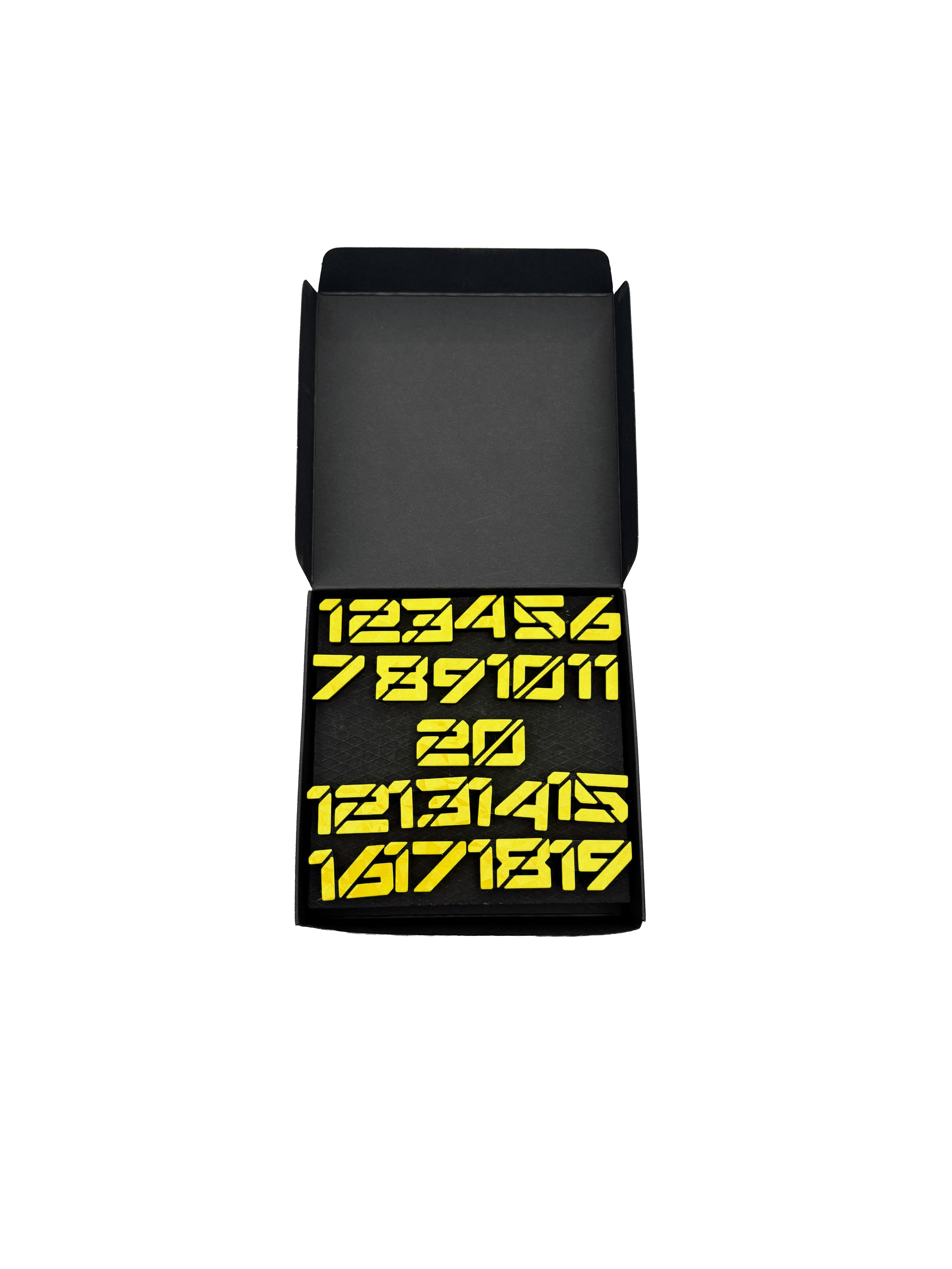 Anelli numerici per freccette McDart / Anello numerico Cyber Die Datei trägt den Namen 'Cyber Gelb Box'. Abgebildet ist vermutlich eine Verpackung in Gelb.