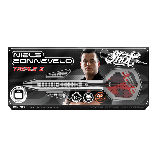 Auf dem Bild ist die Verpackung der "Shot Niels Zonneveld V2 Steeldarts" zu sehen. Die Verpackung zeigt einen Dartpfeil, das Logo und ein Porträt von Niels Zonneveld.