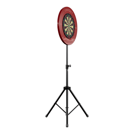 Supporto per bersaglio per freccette Das Bild zeigt einen Dartboard-Ständer mit einer runden Dartscheibe und rotem Auffangring. Der Ständer hat drei stabile Beine und ist höhenverstellbar.