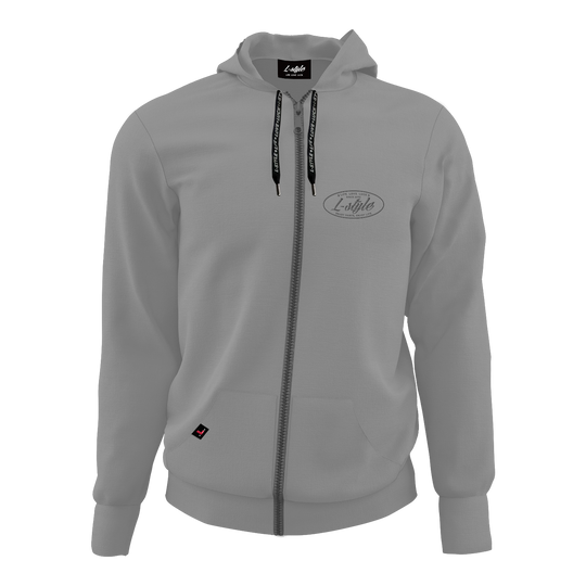 Felpa con cappuccio L-Style - Grigio Der Hoodie „L-Style Hoodie - Grau“ ist grau, hat eine Kapuze und einen durchgehenden Reißverschluss. Auf der linken Brust befindet sich ein dezentes L-Style Logo.