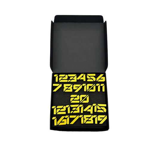 Anelli numerici per freccette McDart / Anello numerico Cyber Die Datei trägt den Namen 'Cyber Gelb Box'. Abgebildet ist vermutlich eine Verpackung in Gelb.