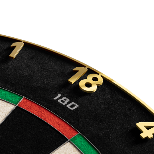 Bersaglio per freccette in acciaio Precise 180 Endorphine con anello numerato - Oro Hier sieht man das Precise 180 Endorphine Steeldartboard mit Nummernring in Gold. Die goldene Dartscheibe ist für präzises Spielen konzipiert.